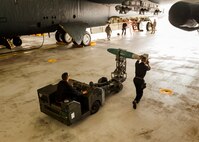 Airmen from the 5th Aircraft Maintenance Squadron Global Strike Challenge team transport an inert GBU-38 munition to a B-52H Stratofortress at Minot Air Force Base, N.D., June 19, 2017. During the competition, the four-member GSC team was evaluated and scored based on their speed, precision and bomb-loading expertise. (U.S. Air Force photo/Senior Airman J.T. Armstrong)