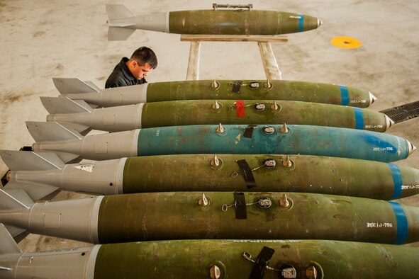 Senior Airman Brian Sanchez, 5th Aircraft Maintenance Squadron weapons load crew member, inspects munitions before they are loaded into a B-52H Stratofortress at Minot Air Force Base, N.D., June 19, 2017. The training muntions were loaded into an aircraft by the 5th AMXS Global Strike Challenge team during their bomb-loading competition. (U.S. Air Force photo/Senior Airman J.T. Armstrong)