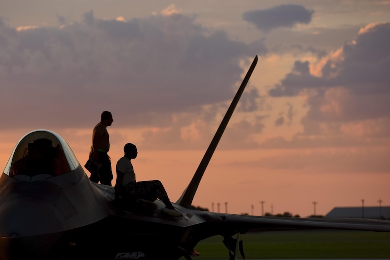 U.S. Air Force Airmen assigned to the 94th Aircraft Maintenance Unit inspect the top of an F-22 Raptor at Joint Base Langley-Eustis, Va., June 26, 2017. While performing their inspection, the Airmen look for any damages to the aircraft that may have occurred during flight. (U.S. Air Force photo/Airman 1st Class Tristan Biese)