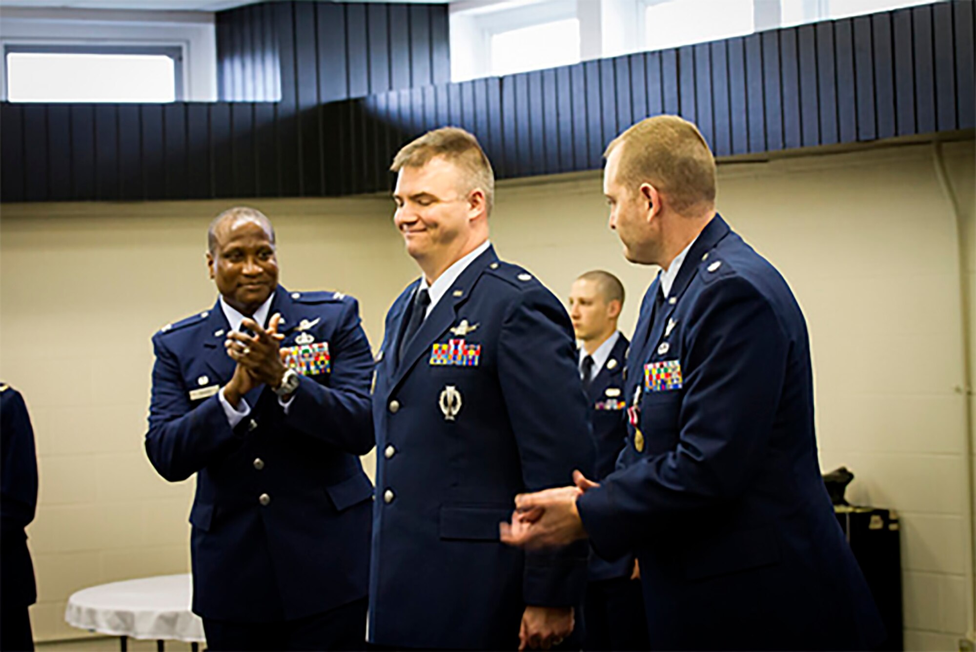 CAVALIER AIR FORCE STATION, ND -- Col. Devin Pepper, 21st Operations Group Commander, congratulates the inbound Commander of the 10th Space Warning Squadron, Lt Col Stephen Hobbs, at a change of command ceremony, June 23, 2017, at Cavalier Air Force Station, N.D.  The 10th SWS operates and maintains the world's most capable phased-array radar system at the Air Force’s only CONUS Isolated installation.  The Perimeter Acquisition Radar Attack Characterization System continuously provides critical missile warning and space surveillance data to North American Aerospace Defense Command, United States Strategic Command, and regional combatant commanders.  PARCS monitors and tracks more than half of all earth-orbiting objects to enable space situational awareness and space control. (Courtesy photo)