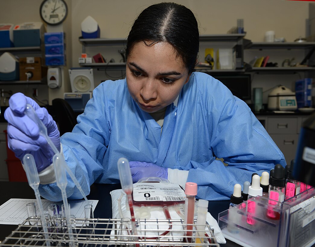 U.S. Air Force Staff Sgt. Mari Crespo, 633rd Medical Support Squadron Laboratory medical laboratory technician, conducts tests on a blood bank unit at Joint Base Langley-Eustis, Va., June 26, 2017. Blood units are used for transfusions in emergency situations and surgical procedures. (U.S. Air Force photo/Staff Sgt. Teresa J. Cleveland)