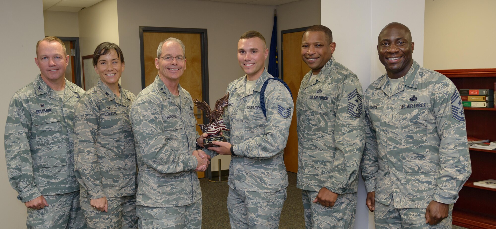 Maj. Gen. Bob LaBrutta, 2nd Air Force commander, and 81st Training Wing leadership presents the 2nd AF Outstanding NCO of the Year award to Staff Sgt. Zachary Bartlett, 81st Training Support Squadron military training leader, in the Levitow Training Support Facility June 20, 2017, on Keesler Air Force Base, Miss. The 2nd AF vision is to be the premier training and development center in the Defense Department. (U.S. Air Force photo by André Askew)
