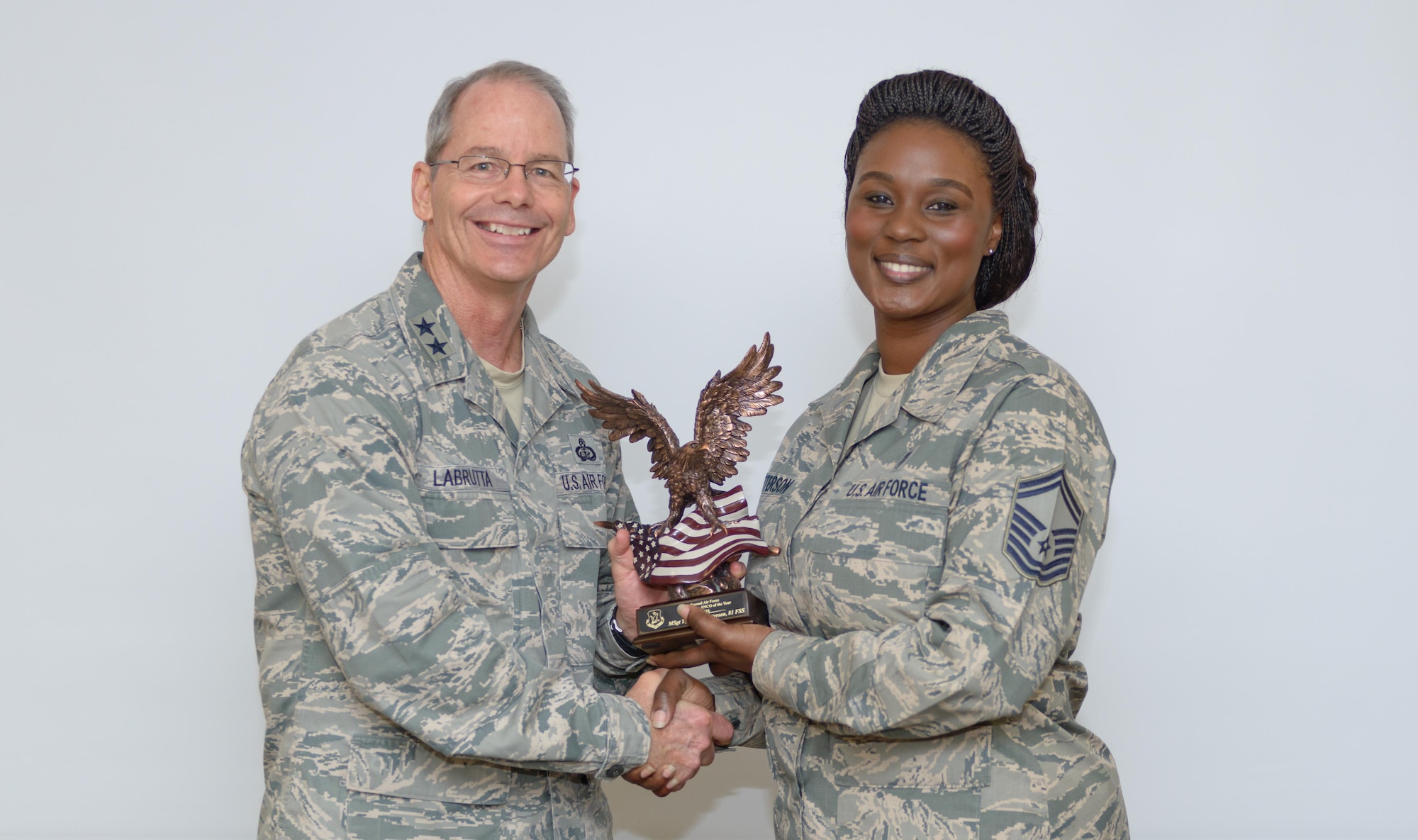 Maj. Gen. Bob LaBrutta, 2nd Air Force commander, presents the 2nd AF Outstanding Senior NCO of the Year award to Senior Master Sgt. Tiffany Patterson, 81st Force Support Squadron career assistance advisor, in the Professional Development Center June 20, 2017, on Keesler Air Force Base, Miss. A career assistance advisor educates the installation’s Airmen on retraining opportunities, benefits, and entitlements. They also host professional development events available to military, civilian. (U.S. Air Force photo by André Askew)