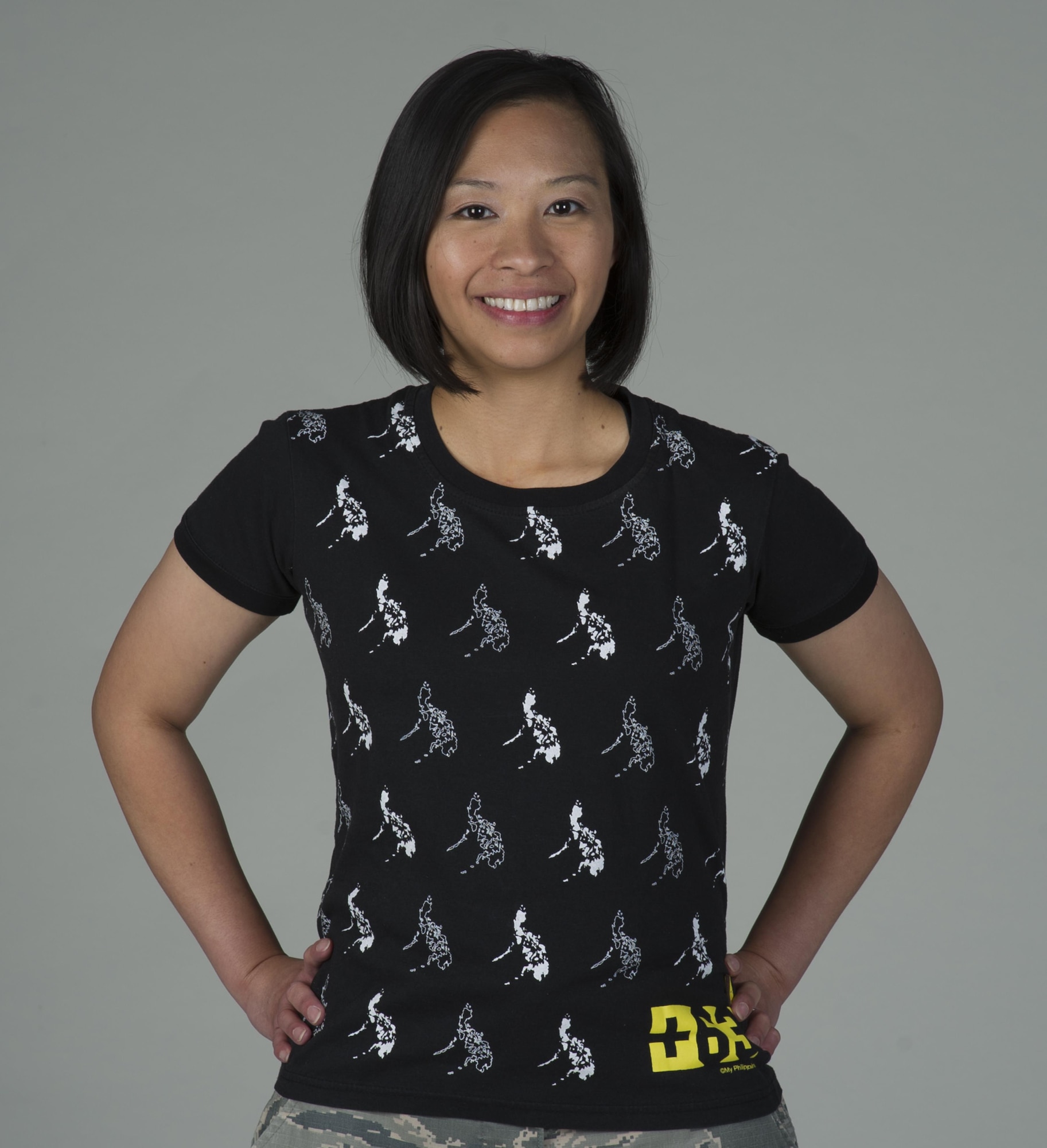 Staff Sgt. Jael Thomas, 60th Comptroller Squadron, poses for a photo June 9, 2017 at Travis Air Force Base, Calif., while wearing a shirt featuring images of the Philippines, her home country. Thomas joined the Air Force in October 2010. As a member of the 60th CPTS, she helps provide financial services to more than 12,000 people. (U.S. Air Force photo/ Heide Couch)
