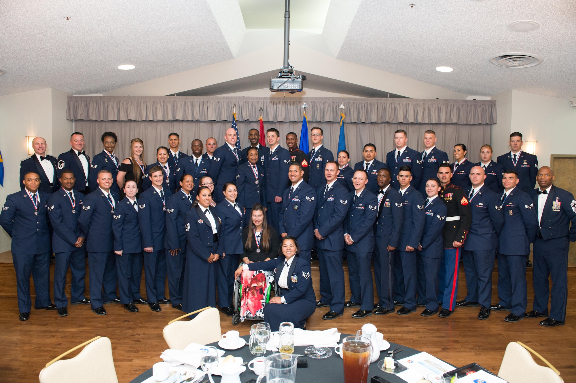Airman Leadership School Class 17E pose for a group photo following their graduation ceremony at Club Muroc June 22. (U.S. Air Force photo by Jennifer Correa)