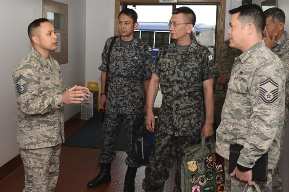 U.S. Air Force Senior Master Sgt. Franklin Perez, the Airman Leadership School (ALS) Commandant, speaks to Warrant Officer Katsumi Yamazaki, the Japan Air Self Defense Force senior enlisted advisor, about ALS, June 23, 2017, at Eielson Air Force Base, Alaska. During Yamazaki’s tour, he visited ALS and the First Term Airmen Center where he learned how the Air Force grooms Airmen into non-commissioned officers. (U.S. Air Force photo by Airman 1st Class Isaac Johnson)