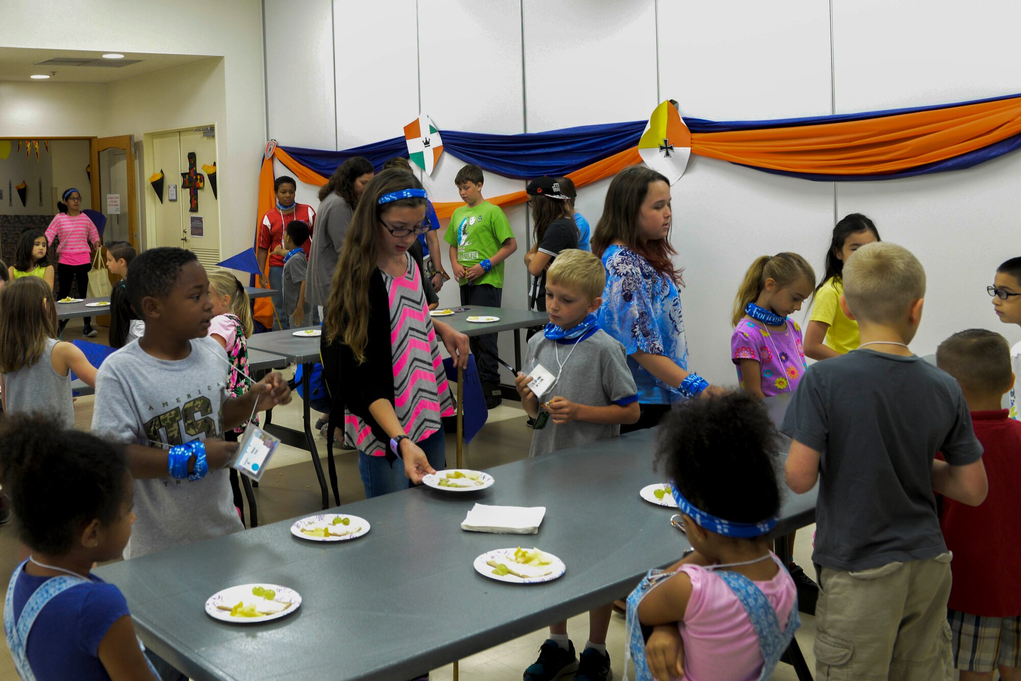 Children wait to eat their snacks during Yokota’s annual Vacation Bible School at Yokota Air Base, Japan, June 23, 2017. The chapel was decorated to represent a medieval castle for the theme of ‘Mighty Fortress’.