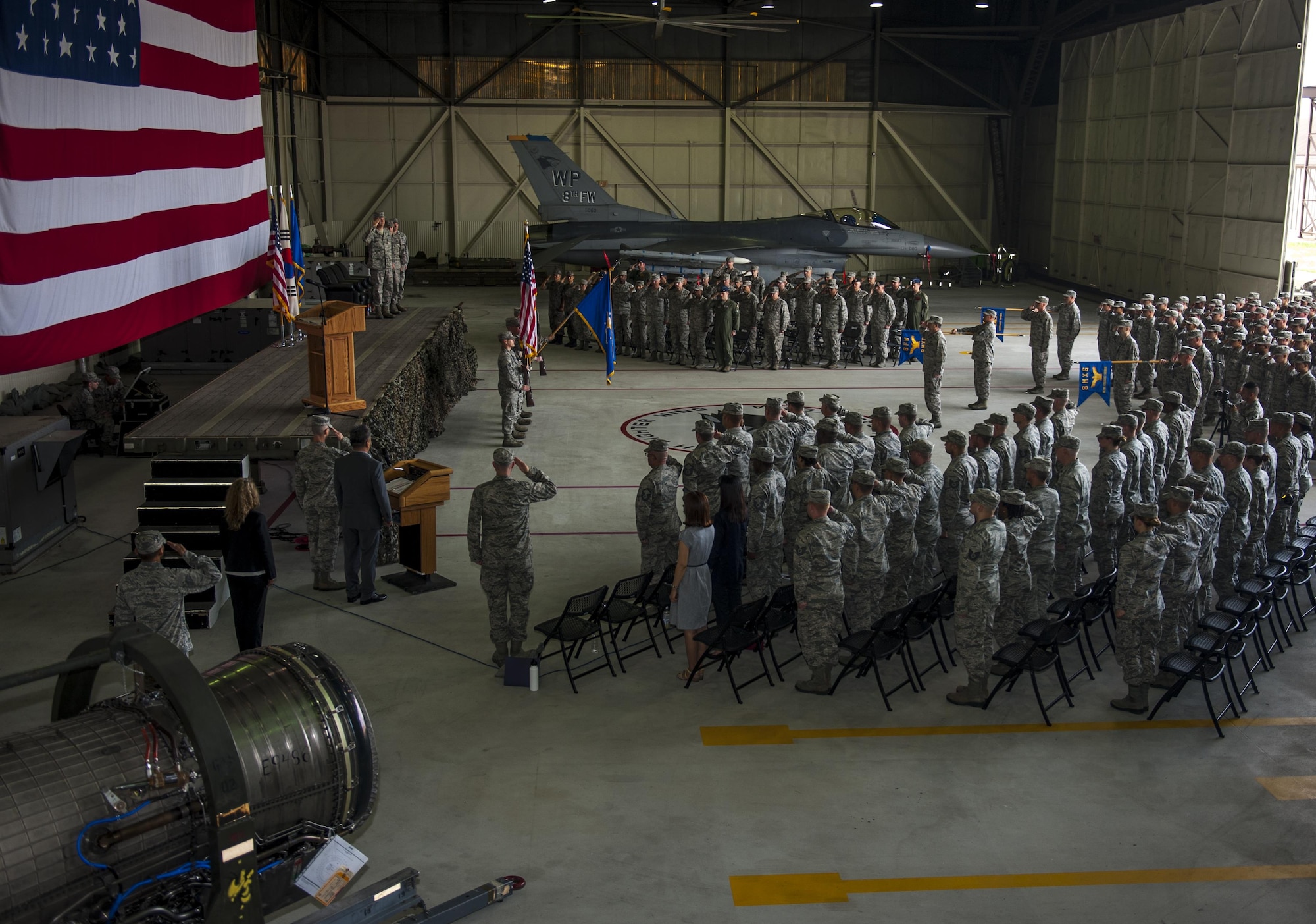 U.S. Air Force Col. David Shoemaker, 8th Fighter Wing commander, Col. James Long, 8th Maintenance Group outgoing commander, and Col. George Sebren, 8th MXG incoming commander, salute June 28, 2017, during a change of command ceremony at Kunsan Air Base, Republic of Korea. During the ceremony, Long relinquished command of the 8th MXG to Sebren. (U.S. Air Force photo by Senior Airman Colville McFee/Released)