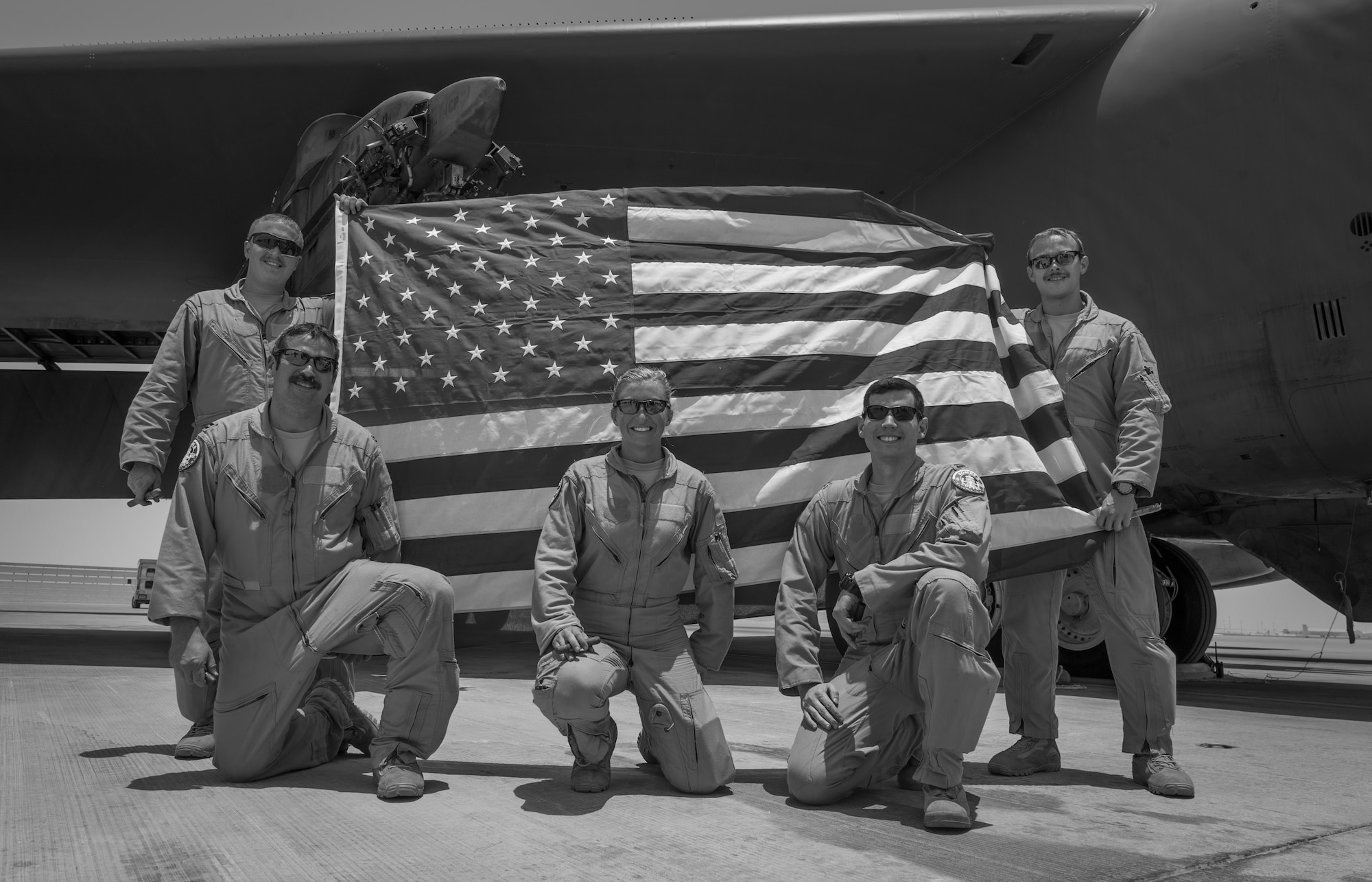 B-52 Stratofortress aircrew, assigned to the 23rd Expeditionary Bomb Squadron, pose for a photo after returning from a flight at an undisclosed location in Southwest Asia, June 16, 2017. The flight was the 400th consecutive sortie without a maintenance cancellation on the day the unit celebrated its 100th anniversary. (U.S. Air Force photo by Staff Sgt. Trevor T. McBride) 
