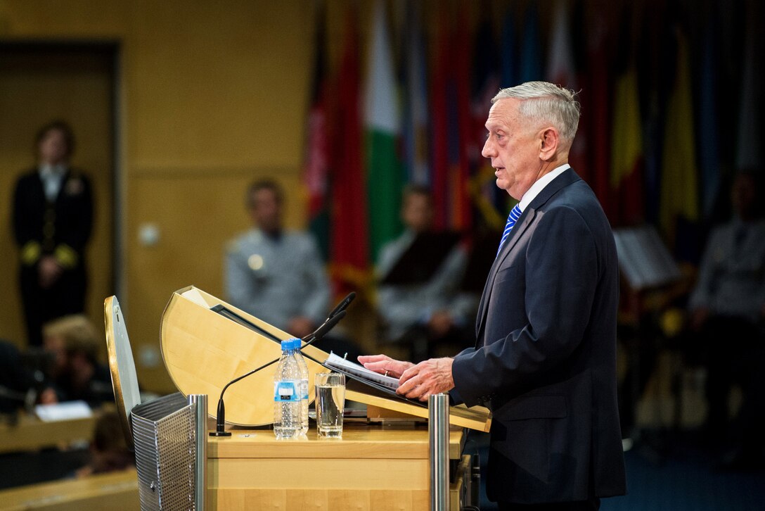 A close up of Defense Secretary Jim Mattis speaking at a podium.