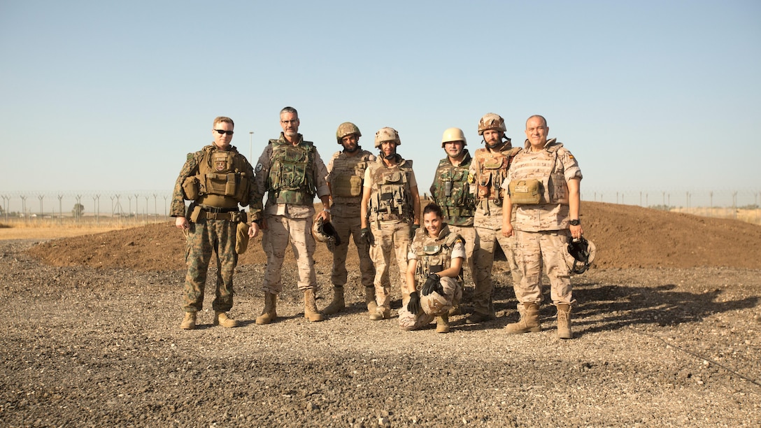 Warrant Officer Dan Pare, left, explosive ordnance disposal officer for Special Purpose Marine Air-Ground Task Force-Crisis Response-Africa, stands with EOD personnel of the Spanish Second Air Support Deployment Squadron (SEADA) after the successful completion of a joint explosive demolition training at Morón Air Base, Spain, June 20, 2017. This was the first time, either jointly or separately, U.S. and Spanish EOD personnel conducted live, explosive ordnance training on the air base. (U. S. Marine Corps photo by Staff Sgt. Kenneth K. Trotter Jr./Released)