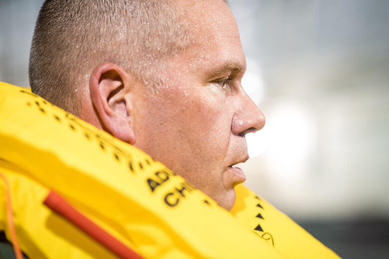 POPE ARMY AIRFIELD, N.C. -- Capt. Shane Ryan, a flight nurse with the 43d Aeromedical Evacuation Squadron, listens as a Survival, Evasion, Rescue and Escape specialist from the 437th Operations Support Squadron provides diirections at the end of a SERE water survival course here May 16. Aircrew members in the 43d AES and 43d Operations Support Squadron completed the course to maintain proficiency in the use of flotation devices and other available equipment during an overwater emergency. The 43d AES and 43d OSS are part of the 43d Air Mobility Operations Group here at Pope Field, and the 437th OSS is part of the 437th Airlift Wing at Joint Base Charleston, S.C. (U.S. Air Force photo/Marc Barnes)