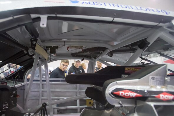 WELCOME, N.C. -- Airmen from the 43d Air Mobility Operations Group at Pope Army Airfield, North Carolina, take a look inside the No. 3 race car of NASCAR driver Austin Dillon during a teambuilding event at Richard Childress Racing here June 13. With a big win in the Coca-Cola 600 still fresh in their memory, RCR pit crew coaches and team members trained Airmen at various pit crew positions, and then gave them the opportunity to put their training to the test in a race-style pit area. (U.S. Air Force photo/Marc Barnes)