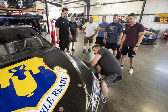 WELCOME, N.C. -- Richard Childress Racing pit crew coaches and team members here trained Airmen at various pit crew positions, and then gave them the opportunity to put their training to the test in a race-style pit area during a teambuilding event at RCR's headquarters here June 13. Airmen from the 43d Air Mobility Squadron and 43d Aeromedical Evacuation Squadron at Pope Army Airfield, North Carolina, put their teambuilding skills to the test during the event at RCR. (U.S. Air Force photo/Marc Barnes)