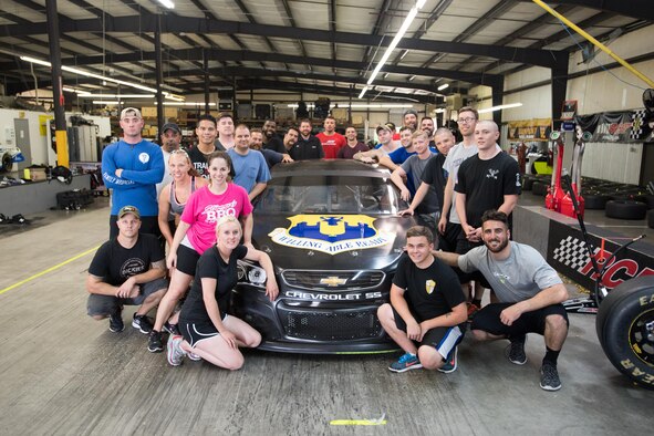 WELCOME, N.C. -- Airmen from the 43d Air Mobility Operations Group at Pope Army Airfield, North Carolina, participated in a teambuilding event at Richard Childress Racing here June 13. RCR pit crew coaches and team members trained Airmen at various pit crew positions, and then gave them the opportunity to put their training to the test in a race-style pit area. (U.S. Air Force photo/Marc Barnes)