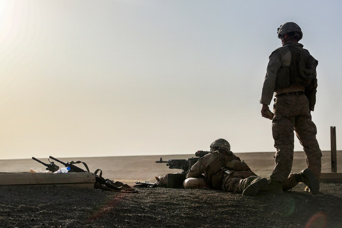 A Marine fires an M240B machine gun as a team member observes at Camp Shorabak, Afghanistan, June 25, 2017. Marine Corps photo by Sgt. Lucas Hopkins