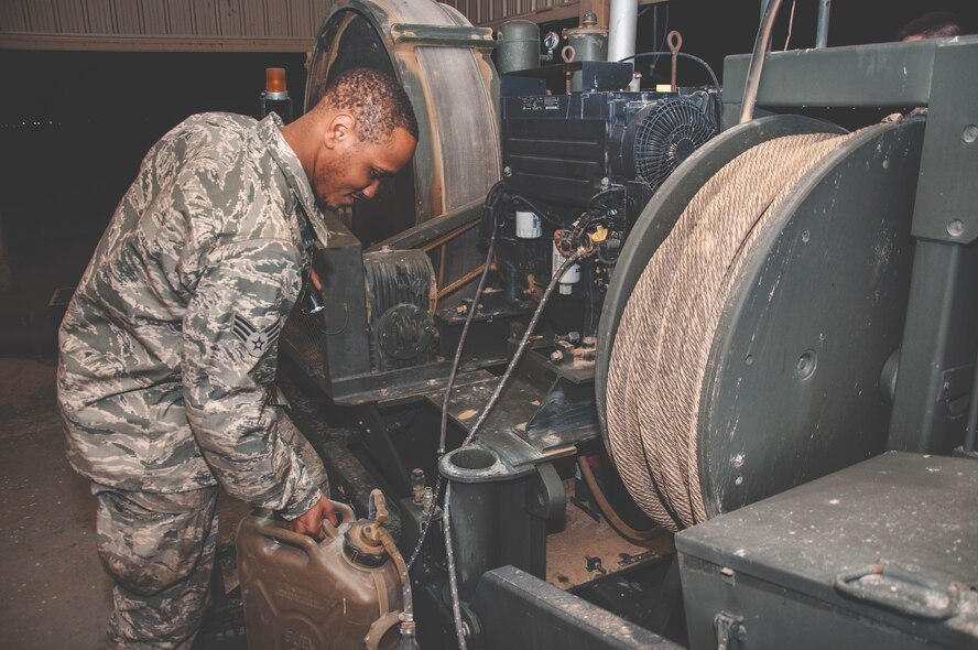 Senior Airman Quentin Palmore, a power production specialist assigned to the 386th Expeditionary Civil Engineer Squadron, conducts and inspection on a mobile aircraft arresting system at an undisclosed location in southwest Asia, June 24, 2017. A visual inspection is performed on these units daily. (U.S. Air Force Photo/Master Sgt. Eric M. Sharman)
