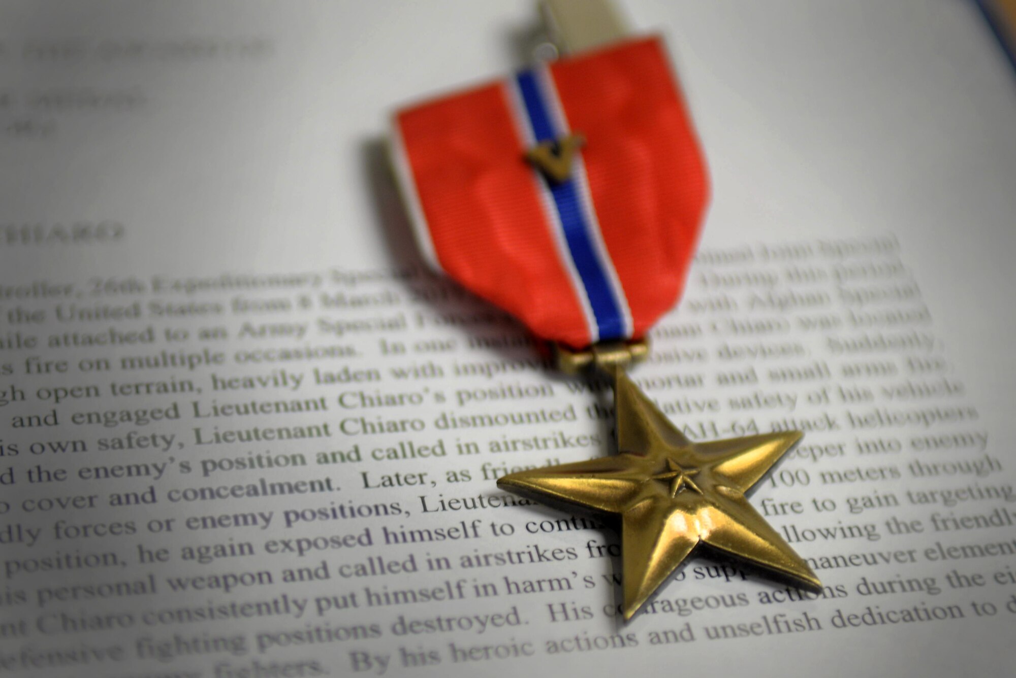 A Bronze Star Medal rests on a table during the award presentation ceremony for three Air Commandos from the 352d Special Operations Wing June 27, 2017, on RAF Mildenhall, England. The Medal is awarded to any person who, after December 6, 1941, while serving in any capacity with the Armed Forces of the United States, distinguishes himself or herself by heroic or meritorious achievement or service, not involving participation in aerial flight. (U.S. Air Force photo by Airman 1st Class Tenley Long)