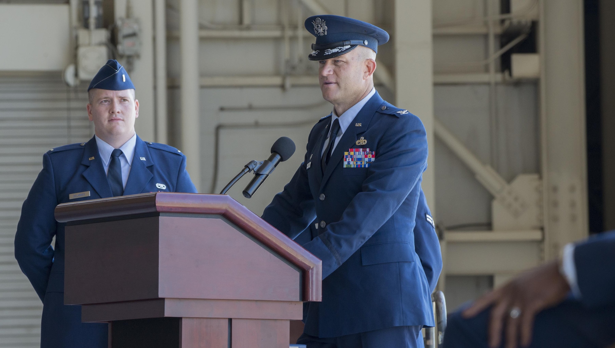 U.S. Air Force Col. David A. Hammerschmidt, 60th Maintenance Group commander, speaks to the audience after assuming command from Col. Earl S. Scott during a change of command ceremony, June 23, 2017.  The 60th Maintenance Group has 2,200+ active, civilian, and reserve personnel supporting organizational and field-level maintenance for 18 C-5M Super Galaxys, 13 C-17 Globemasters, and 27 KC-10 Extenders at Air Mobility Command's largest wing. U.S. Air Force Col. Earl S. Scott relinquished command to Col. David A. Hammerschmidt during a ceremony rooted in military history dating back to the 18th Century where the command flag is passed to the individual assuming command in the presence of the entire unit. (U.S. Air Force photo/ Heide Couch)