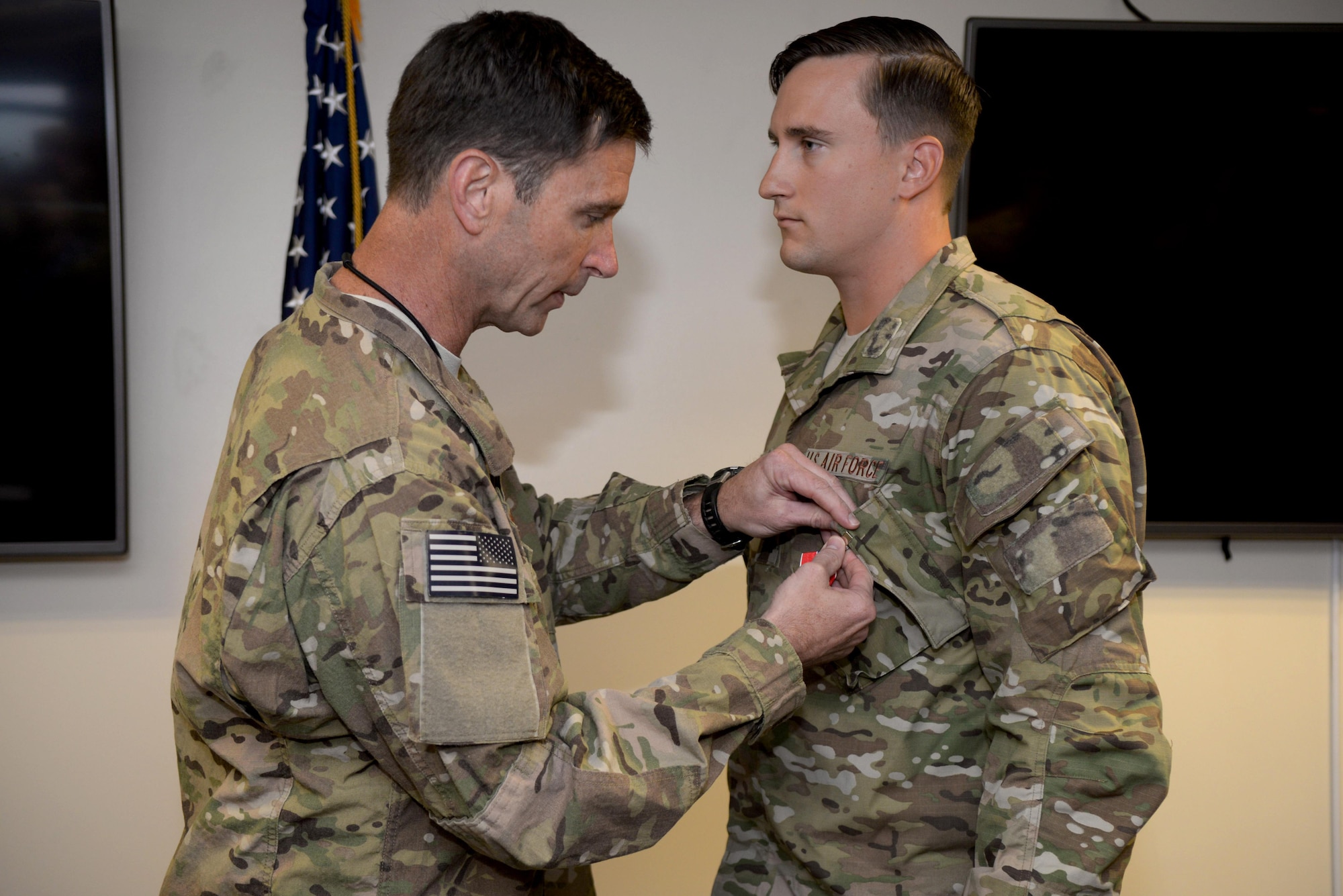 U.S. Air Force Col. Matthew Smith, left, 352d Special Operations Wing commander, pins the Bronze Star Medal on U.S. Air Force Capt. Anthony Chiaro, right, 321st Special Tactic Squadron, June 27, 2017, on RAF Mildenhall, England. While deployed, Chiaro exhibited meritorious service during combat operations, thus earning the Bronze Star Medal. (U.S. Air Force photo by Airman 1st Class Tenley Long)