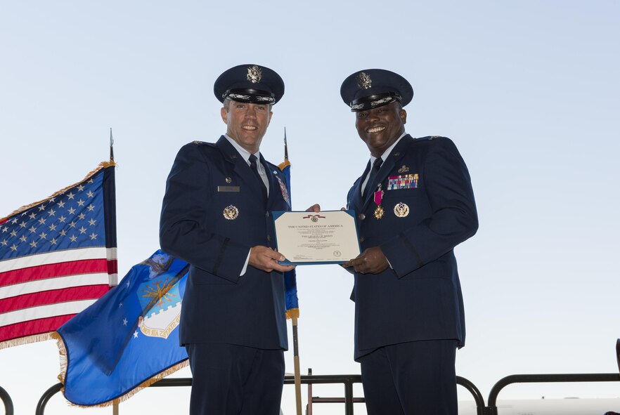 U.S. Air Force Col. John Klein, commander, 60th Air Mobility Wing, Travis AFB, Calif., presents Col. Earl Scott, outgoing 60th Maintenance Group commander, the Legion of Merit during the 60th MXG Change of Command Ceremony where Scott relinquished command to Col. David A. Hammerschmidt, June 23, 2017. The 60th Maintenance Group has 2,200+ active, civilian, and reserve personnel supporting organizational and field-level maintenance for 18 C-5M Super Galaxy, 13 C-17 Globemaster, and 27 KC-10 Extender aircraft at Air Mobility Command's largest wing. U.S. Air Force Col. Earl S. Scott relinquished command to Col. David A. Hammerschmidt during a ceremony rooted in military history dating back to the 18th Century where the command flag is passed to the individual assuming command in the presence of the entire unit. (U.S. Air Force photo/ Heide Couch) 