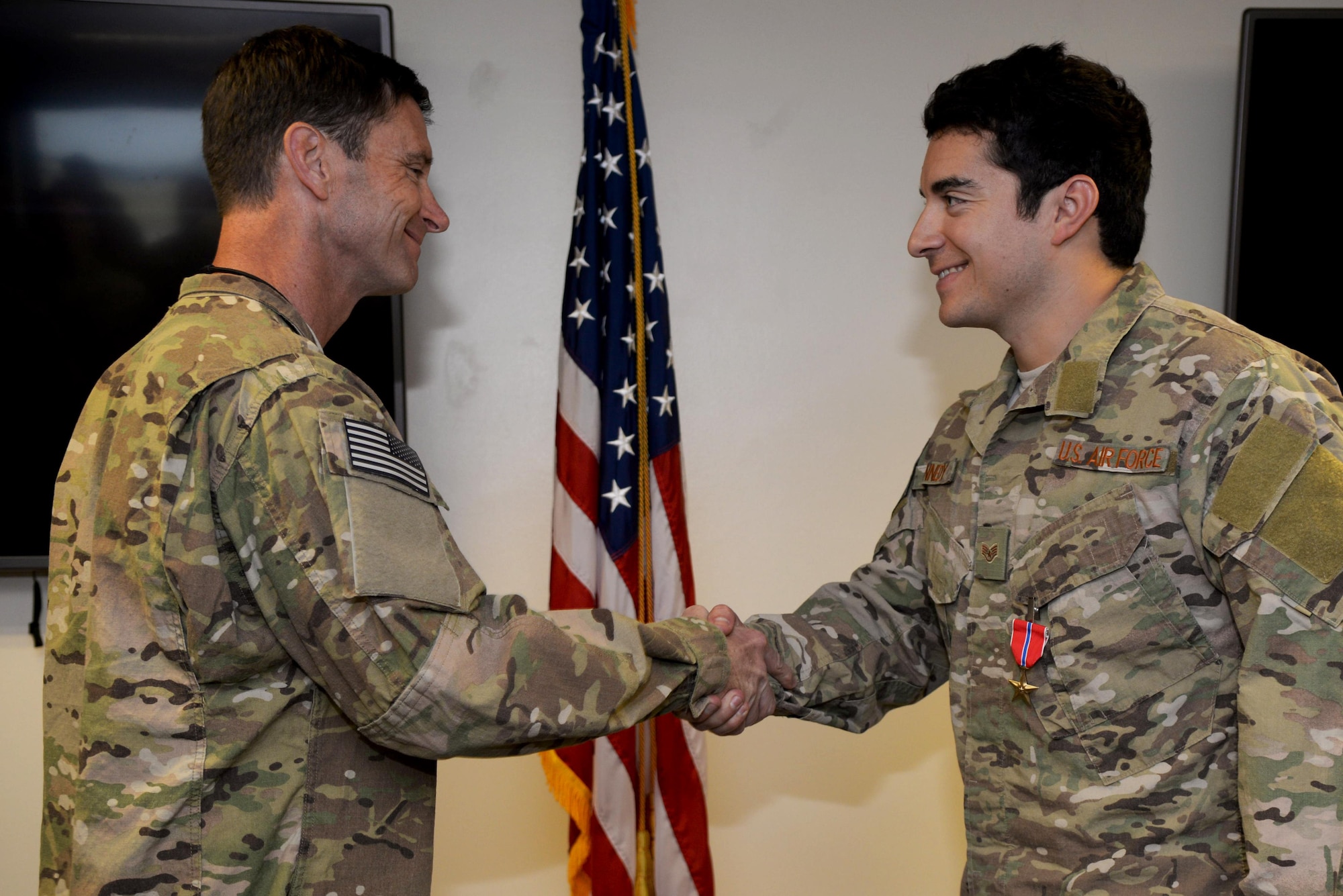 U.S. Air Force Col. Matthew Smith, left, 352d Special Operations Wing commander, pins the Bronze Star Medal on U.S. Air Force Staff Sgt. Clinton Kennedy, right, 321st Special Tactic Squadron, June 27, 2017, on RAF Mildenhall, England. While deployed, Kennedy exhibited meritorious service during combat operations, thus earning the Bronze Star Medal. (U.S. Air Force photo by Airman 1st Class Tenley Long)
