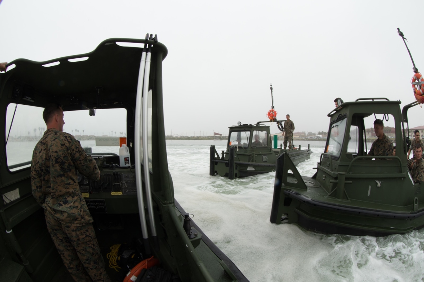 U.S. Marines with Bridge Company, 7th Engineer Support Battalion, 1st Marine Logistics Group perform several Bridge Erection Boat (BEB) maneuvers along the coast of Camp Pendleton, Calif., June 21, 2017. The BEB deploys improved ribbon bridges, which are long two-way platforms used to transport heavy equipment, such as tanks, over bodies of water.  (U.S. Marine Corps photo by Lance Cpl. Timothy Shoemaker)