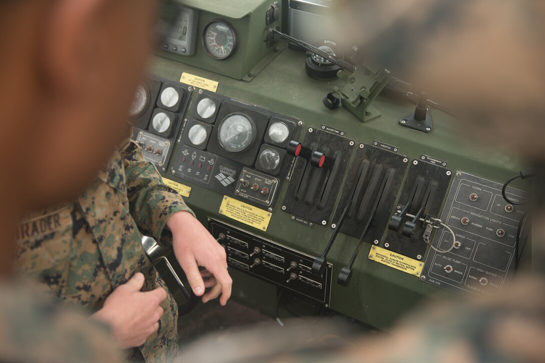U.S. Marine Cpl. Braxter Shrader, a combat engineer with Bridge Company, 7th Engineer Support Battalion, 1st Marine Logistics Group teaches Sgt. Lewis Kennedy the ins and outs of the Bridge Erection Boat (BEB) on Camp Pendleton Calif., June 21, 2017. The BEB deploys improved ribbon bridges, which are long two-way platforms used to transport heavy equipment, such as tanks, over bodies of water.  (U.S. Marine Corps photo by Lance Cpl. Timothy Shoemaker)