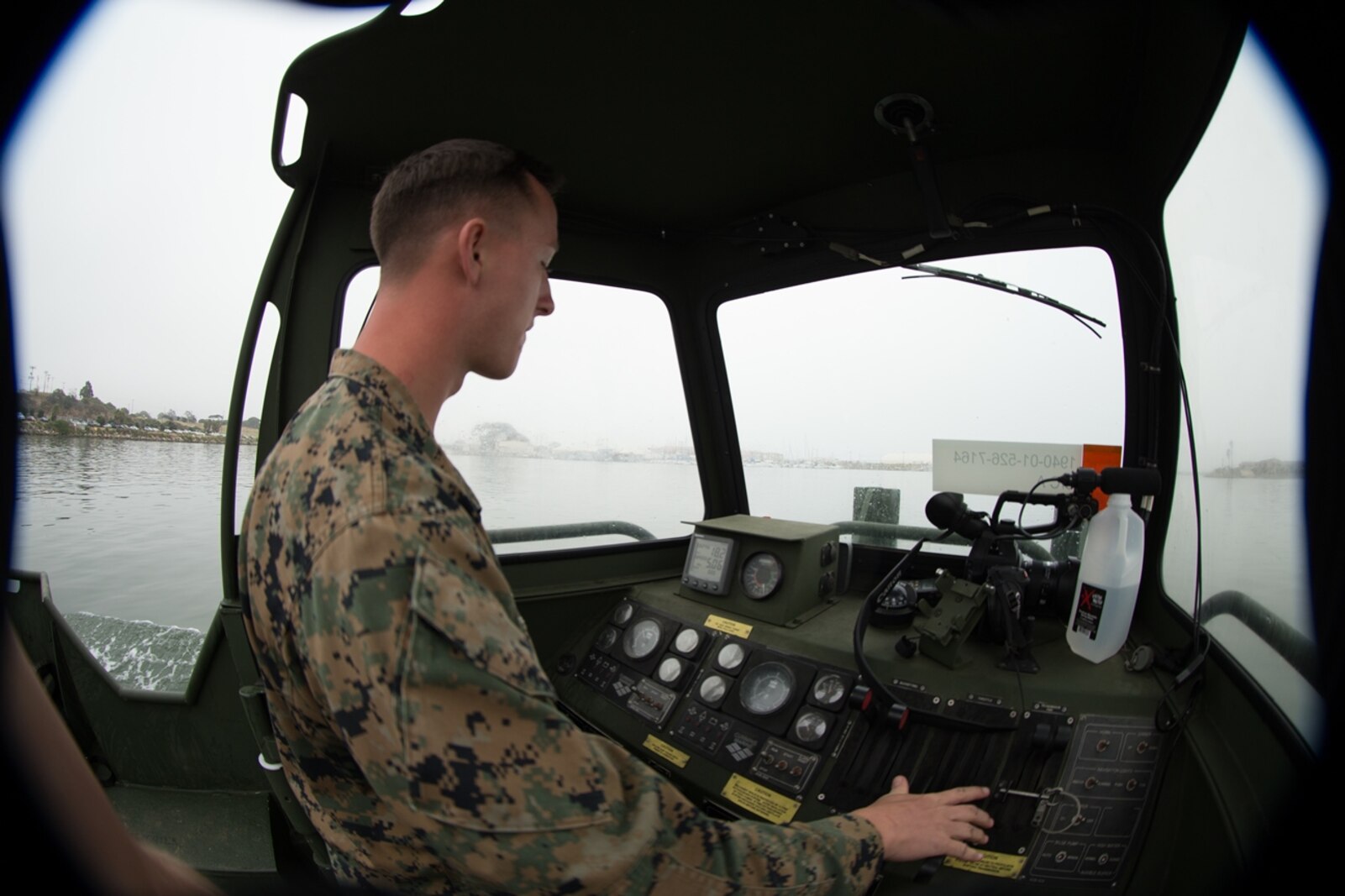 U.S. Marine Cpl. Braxton Shrader, a combat engineer with Bridge Company, 7th Engineer Service Battalion, 1st Marine Logistics Group checks the gauges of the Bridge Erection Boat (BEB) during the boat licensing course along the coast of Camp Pendleton, Calif., June 21, 2017. The BEB deploys improved ribbon bridges, which are long two-way platforms used to transport heavy equipment, such as tanks, over bodies of water. (U.S. Marine Corps photo by Lance Cpl. Timothy Shoemaker)