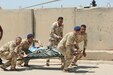 Iraqi security forces soldiers carry a simulated casualty for evaluation during the Iraqi Flight Medic Course at Camp Taji, Iraq, June 8, 2017. The course covered basic casualty care and additional flight-focused instruction in altitude physiology and aircraft safety. This training is part of the overall Combined Joint Task Force – Operation Inherent Resolve building partner capacity mission by training and improving the capability of partnered forces fighting ISIS. CJTF-OIR is the global Coalition to defeat ISIS in Iraq and Syria. (U.S. Army photo by Capt. Stephen James)