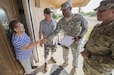 Sgt. 1st Class Rhody Merisier, middle right, and Staff Sgt. Aldo Blanco, both assigned to the 478th Civil Affairs Battalion based in Miami, conduct a survey with residents of a colonia currently without potable water near Laredo, Texas, June 23, 2017. Nearly 200 Reserve Soldiers are participating in an Innovative Readiness Training mission to improve infrastructures in colonias along the Texas-Mexico border. (Photo by Sean Kimmons)
