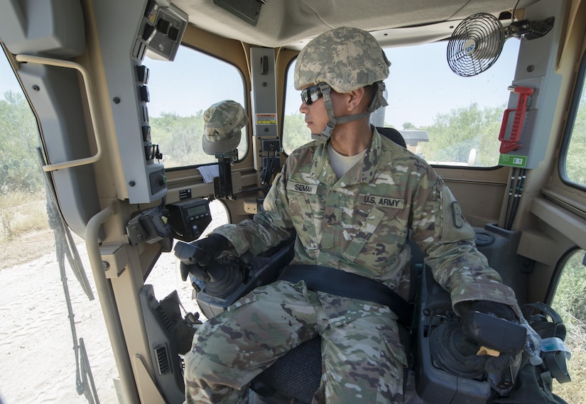 Sgt. Vincent Seman, assigned to the 277th Engineer Company based in San Antonio, prepares to use a road grader while repairing a 2.5-mile stretch of dirt road in a colonia near Laredo, Texas, as part of an Innovative Readiness Training mission June 23, 2017. Seman and nearly 200 Army Reserve Soldiers are participating in the mission along the Texas-Mexico border.  (Photo by Sean Kimmons)