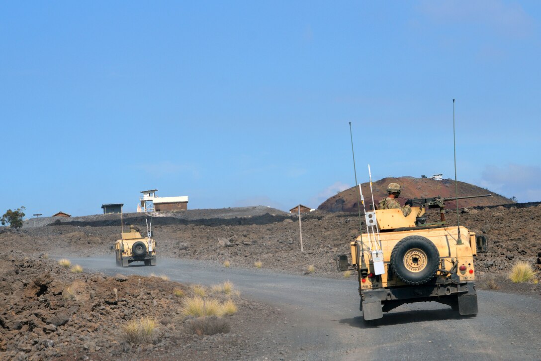 Humvees move in a convoy during an exercise at the Pohakuloa Training Area, Hawaii, June 25, 2017. Army photo by Staff Sgt. Armando R. Limon 