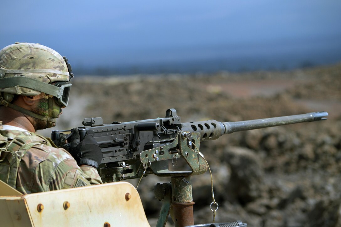 A soldier mans a .50 caliber machine gun atop a Humvee during an exercise at the Pohakuloa Training Area, Hawaii, June 25, 2017. Army photo by Staff Sgt. Armando R. Limon 