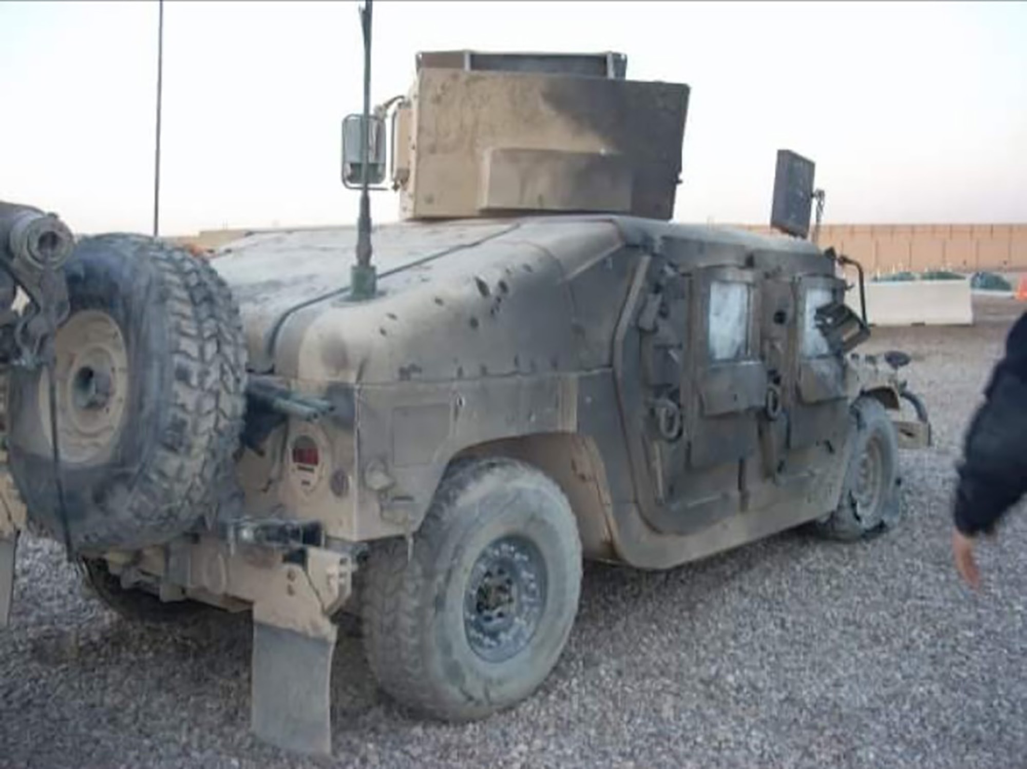 A Humvee is damaged and covered in burn marks after an improvised explosive device was detonated, also injuring then-Senior Airman Christopher D’Angelo, an 819th RED HORSE Squadron heavy equipment operator, Janu. 15, 2008. (Courtesy photo)
