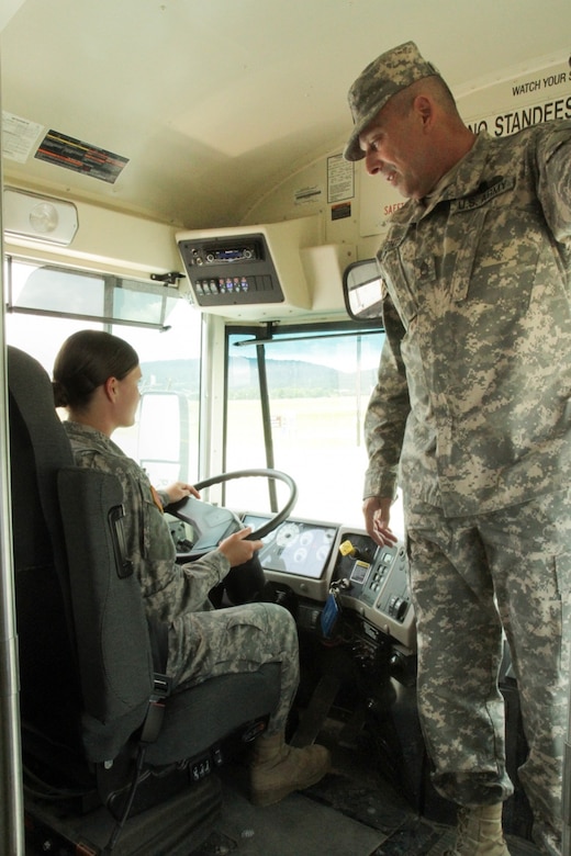 Pennsylvania Army National Guard Spc. Chelsea Bradford, a human resource specialist with Headquarters and Headquarters Detachment, 213th Regional Support Group, takes guidance from Army Master Sgt. John Montes, 213th Regional Support Group senior maintenance supervisor and master driver, as she prepares for her driver’s test during annual training at Fort Indiantown Gap, Pa., June 9, 2017. Army photo by Capt. Gregory McElwain