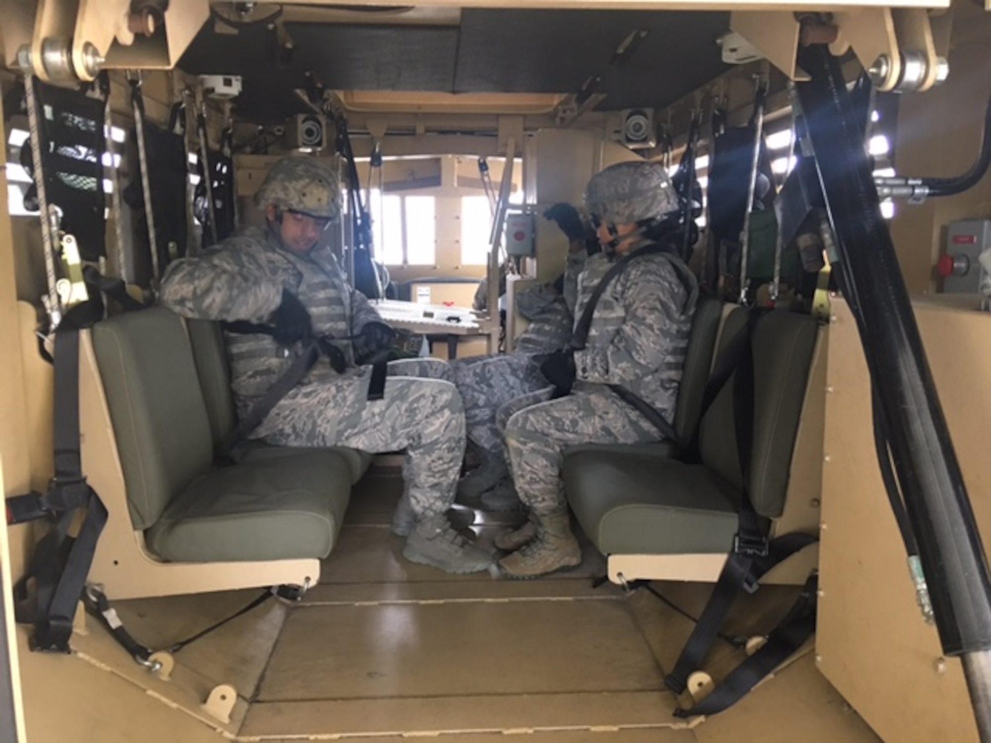 Class members from Emerge Moody sit in a Mine-Resistant Ambush Protected vehicle egress assistance trainer May 2, 2017, at Moody Air Force Base, Ga. Emerge Moody spent the day with the 820th BDG learning about the organization’s mission and capabilities. (Courtesy Photo)