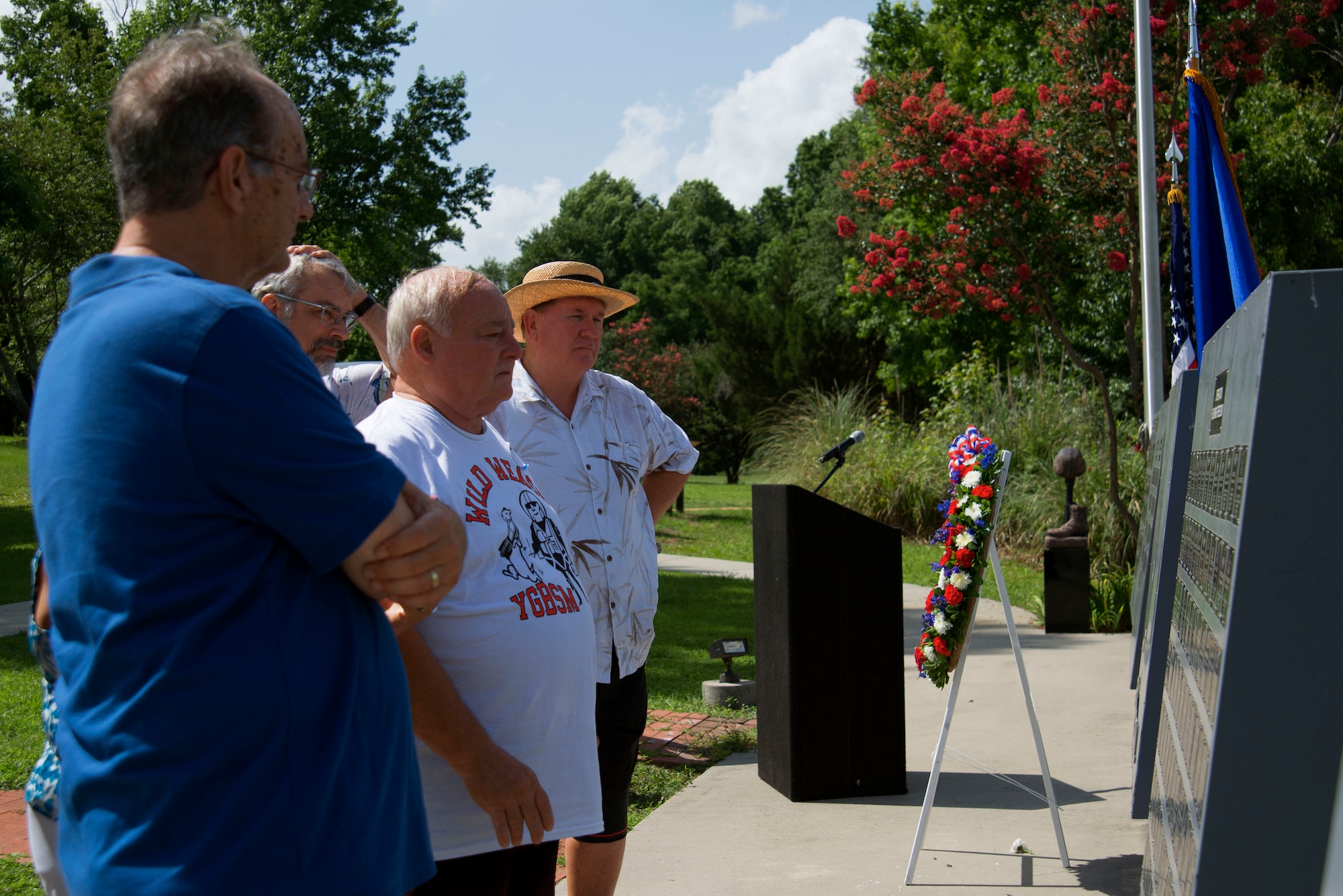 U.S. Air Force veterans read names on the Fallen Airmen Memorial at Shaw Air Force Base, S.C., June 23, 2017. The former Wild Weasels attended a wreath laying ceremony honoring the fallen during their reunion trip, which celebrated the 52nd Wild Weasel anniversary. (U.S. Air Force photo by Airman 1st Class Kathryn R.C. Reaves)