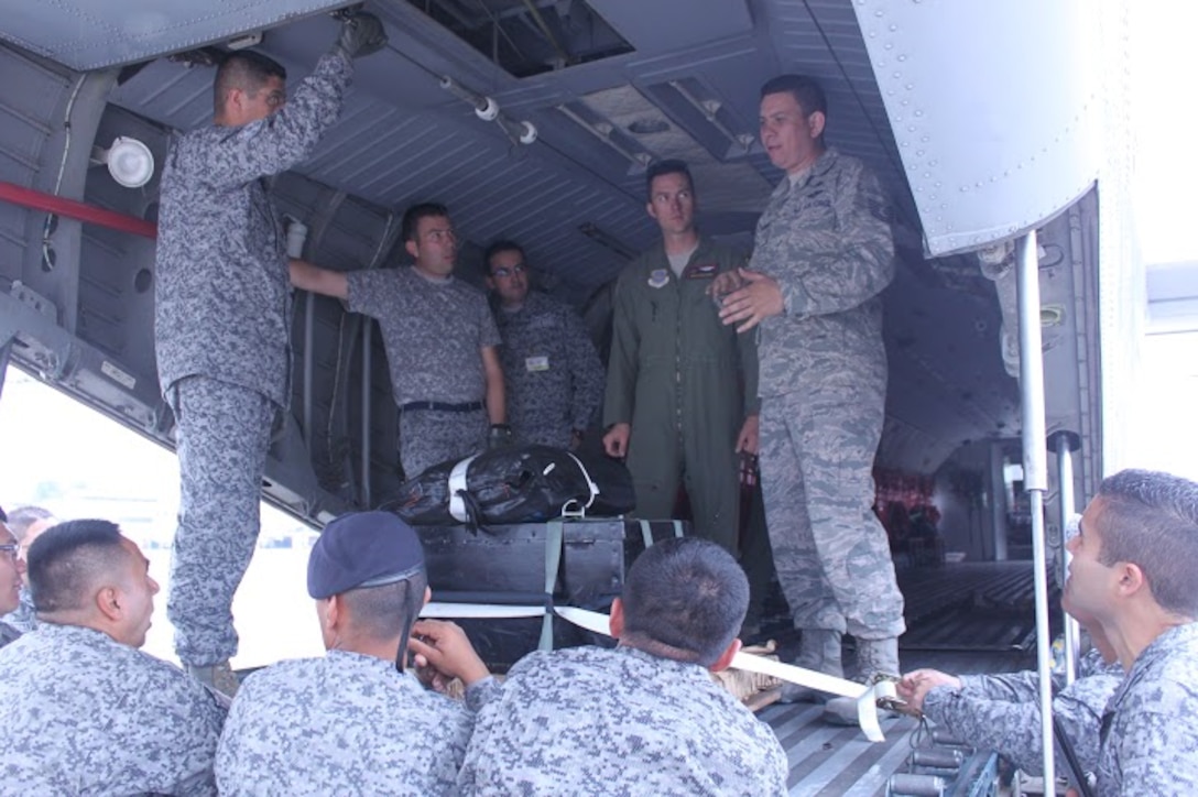 Tech. Sgt. Horacio Guzman Hernandez, 571st Mobility Support Advisory Squadron, teaches Colombian service members rigging techniques. (Courtesy photo)