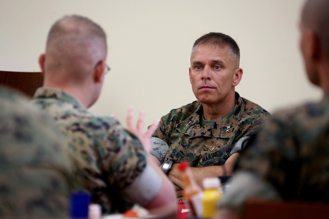 Staff Sgt. James Rader, left, asks a question to Maj. Gen. Matthew Glavy during a breakfast for 2nd Marine Aircraft Wing staff noncommissioned officers at Marine Corps Air Station Cherry Point, N.C., June 28, 2017. During the breakfast, Glavy set aside time to answer questions and open a dialogue between himself and the senior leaders under his command. Glavy is the commanding general for 2nd MAW and Rader is a tactical air defense controller with Marine Tactical Air Command Squadron 28, Marine Air Control Group 28, 2nd MAW. (U.S. Marine Corps photo by Cpl. Jason Jimenez/ Released)