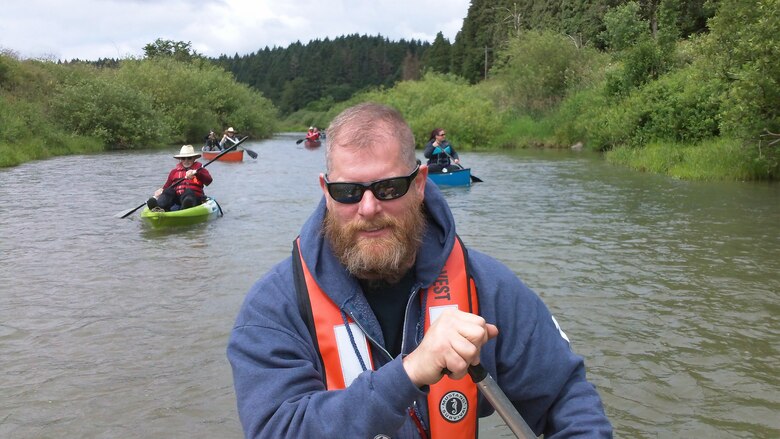 Roger Schlough, Bonneville Lock and Dam crane operator, navigates a canoe down the Long Tom River in the Willamette Valley, June 13. Schlough floated the river with about 20 others from the Portland District, the Long Tom Watershed Council and a private citizen to get a better understanding of the challenges and issues of maintaining the channel.