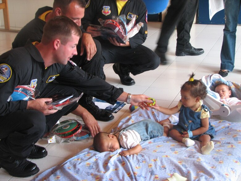 Tech. Sgt. Daryl Page, Viper East Demonstration Team, spreads goodwill at a children's hospital in Medellin, Colombia, June 27. Viper East is the first U.S. team to perform in a Colombian airshow. (U.S. Air Force photo/1st Lt. Christina Mundy) 