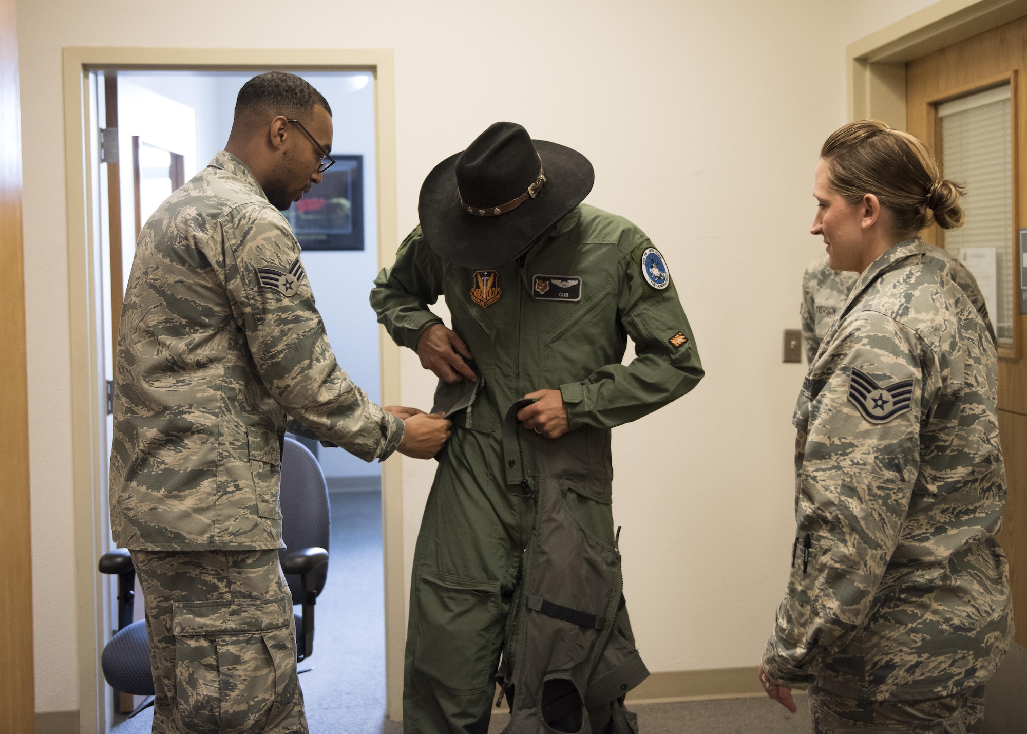 Senior Airman Quincy Neely-Lewis, 366th Operations Support Squadron aircrew flight equipment journeyman, helps prepare Vice Chairman Buster Gibson of the Shoshone-Paiute Tribes of the Duck Valley Indian Reservation for his orientation flight, June 16, 2017, at Mountain Home Air Force Base , Idaho. Aircrew Flight Equipment helps to ensure that all flight and safety equipment is in perfect working order. (U.S. Air Force photo by Airman 1st Class Alaysia Berry/Released)
