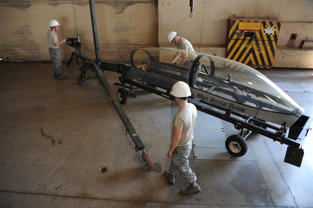 Airmen assigned to the 56th Component Maintenance Squadron prepare an F-16 Fighting Falcon canopy for transport June 26, 2017 at Luke Air Force Base, Ariz. Canopy removal on fighter jets is part of routine maintenance to ensure proper safety for pilots. (U.S. Air Force photo by Airman 1st Class Caleb Worpel) 