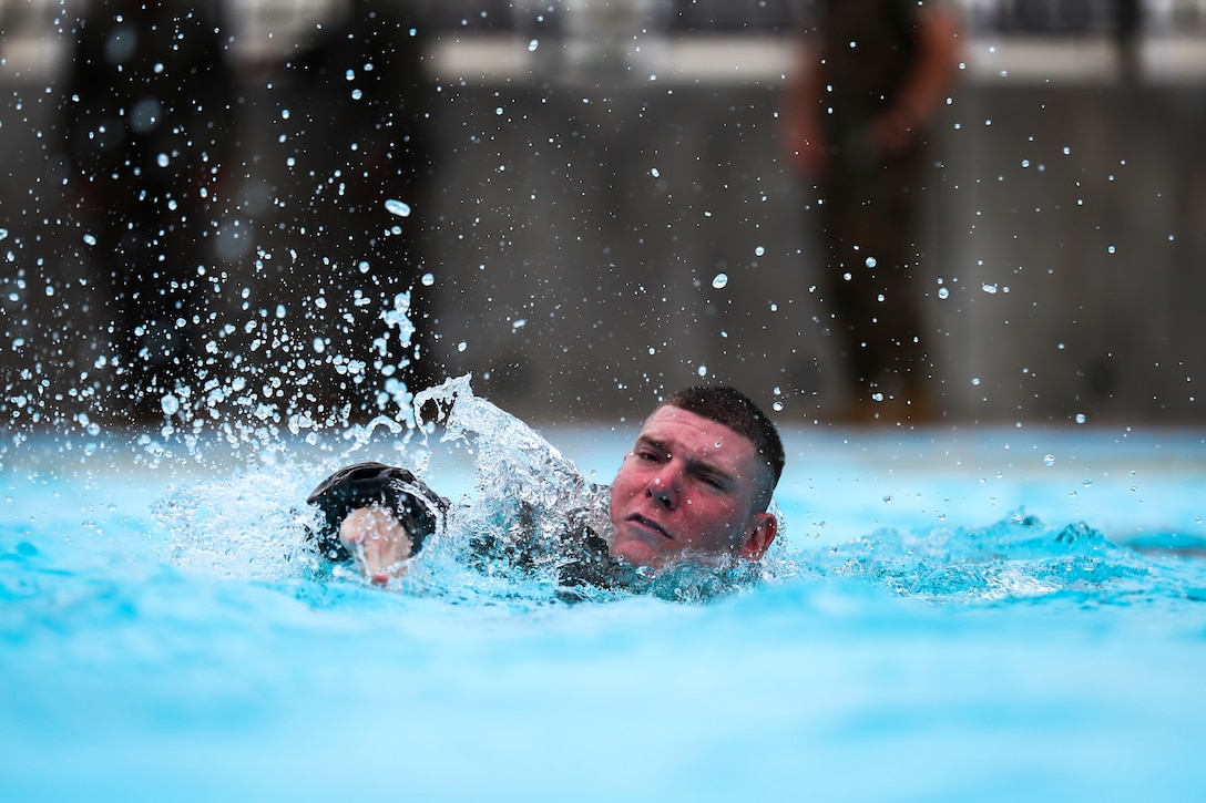 Cpl. Joseph J. Guarrieri, a Lawrenceville, New Jersey native and squad leader assigned to Alpha Company, 1st Battalion, 3rd Marine Regiment, swims across the pool during annual swim qualification aboard Camp Hansen, Okinawa, Japan, June 25, 2017. The Marines completed their swim qualification to build confidence and increase survivability in the water. The Hawaii-based battalion is forward deployed to Okinawa, Japan as part of the Unit Deployment Program. (U.S. Marine Corps photo by Cpl. Aaron S. Patterson/Released)