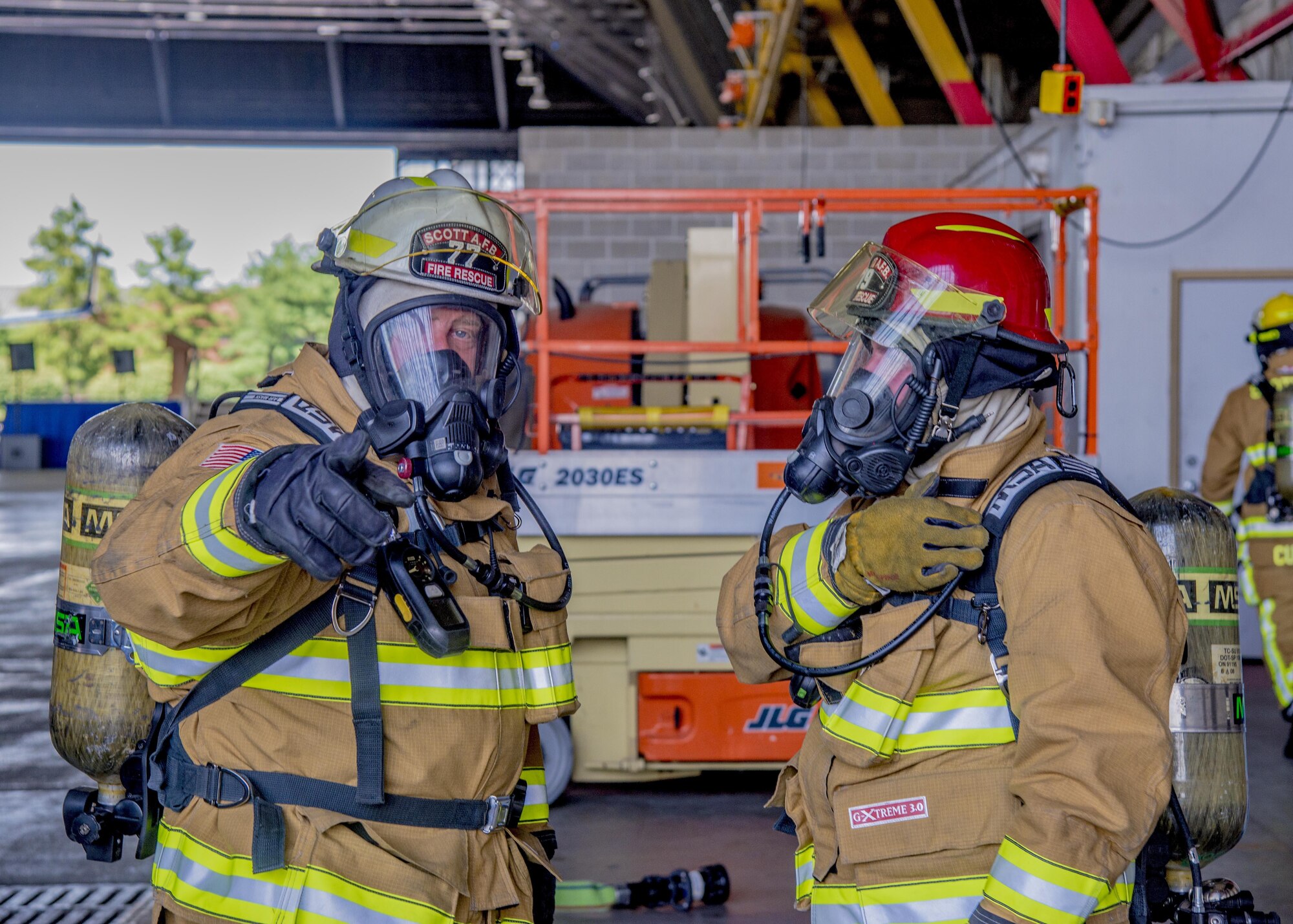 William Johnson, 375th Civil Engineer Squadron station cheif, discusses exercise procedures during a training exercise at Scott Air Force Base, Ill. on June 22, 2017. The exercise was part of the unit's Airport Rescue and Fire Fighting's training which tests their ability to arrive on scene, fight fires, and provide a rescue path as well as recover or rescue personnel. (U.S. Air Force photo by Airman 1st Class Daniel Garcia)