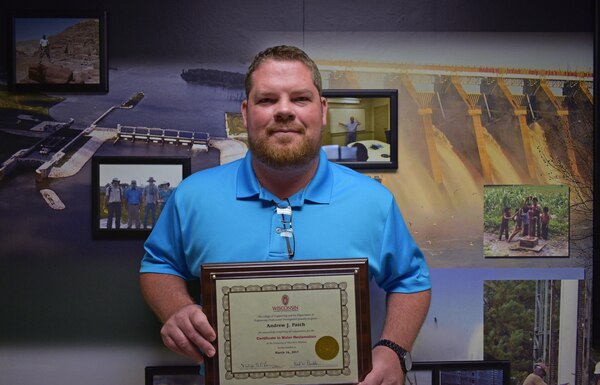 Environmental Engineer Andrew Patch poses for a photo, June 28, with a Certificate in Water Reclamation from the University of Wisconsin-Madison College of Engineering. Patch is the first person in the 168-year history of the university to receive the certificate. (Photo by Matthew Adams, USACE Mobile Public Affairs) 