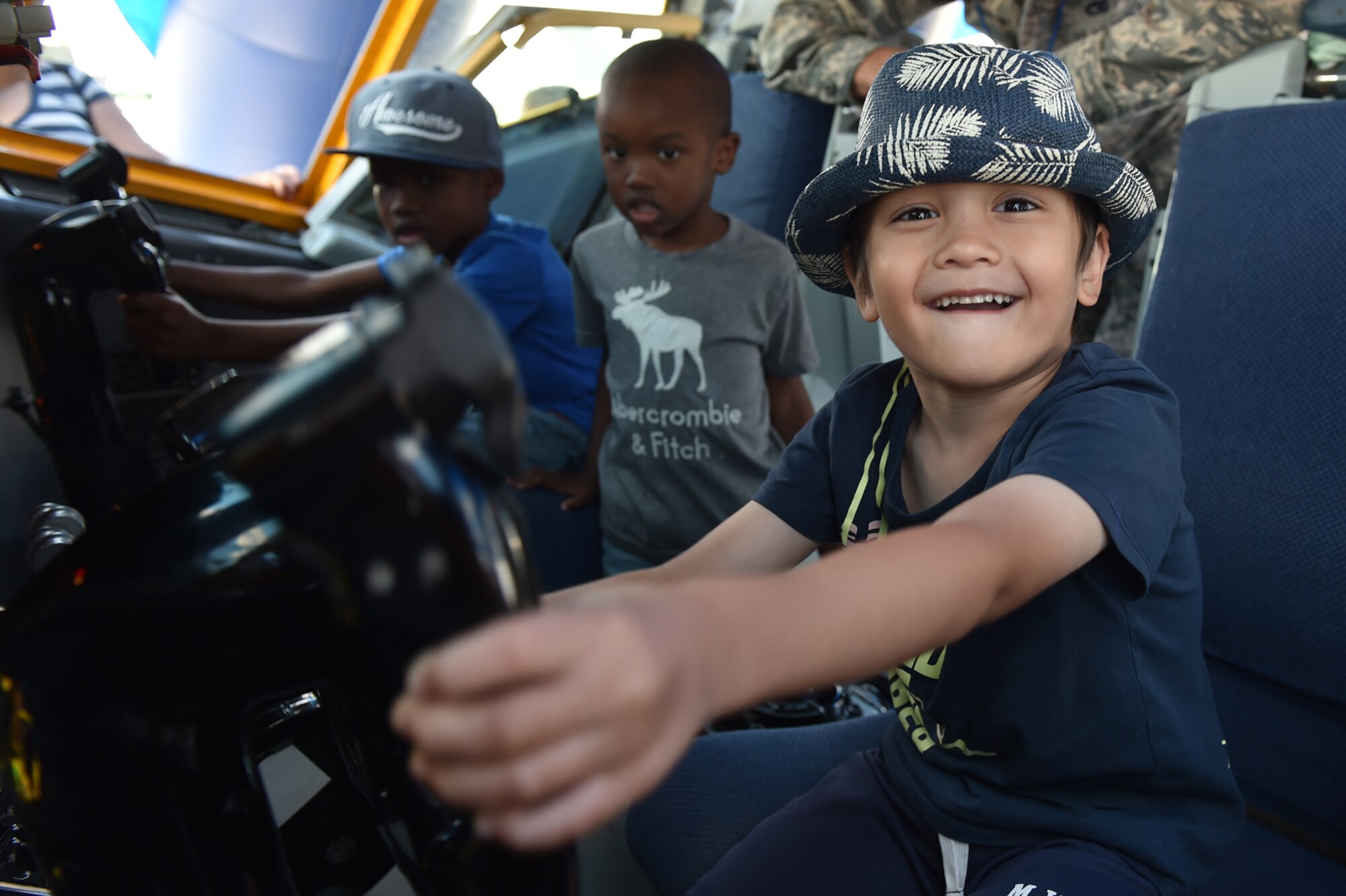 James Goldfuss, 4, is all smiles aboard Grissom's KC-135R Stratotanker interactive flight deck at the Vectren Dayton Airshow in Dayton, Ohio, June 24, 2017. During the event, 12 maintenance Airmen from the 434th Air Refueling Wing volunteered to set up and operate the displays while exchanging military experiences and knowledge with visitors. (U.S. Air Force photo/Staff Sgt. Katrina Heikkinen)