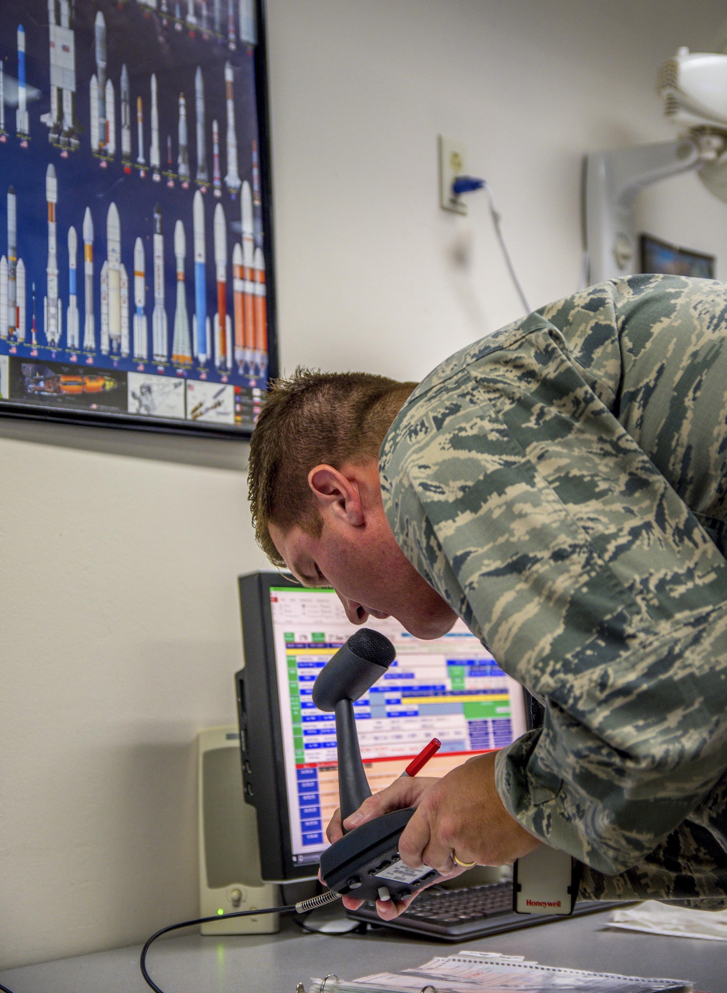 Capt. Justin Toney, 20th Space Control Squadron flight commander, announces over the public announcement system to go into ‘lockdown’ during active shooter training at site C-6 Eglin Air Force Base, Fla., June 27. Walton County Sheriff’s deputies and first responders from Eglin participated in the joint exercise practicing their ability to respond and work as a team. (U.S. Air Force photo/Kristin Stewart)