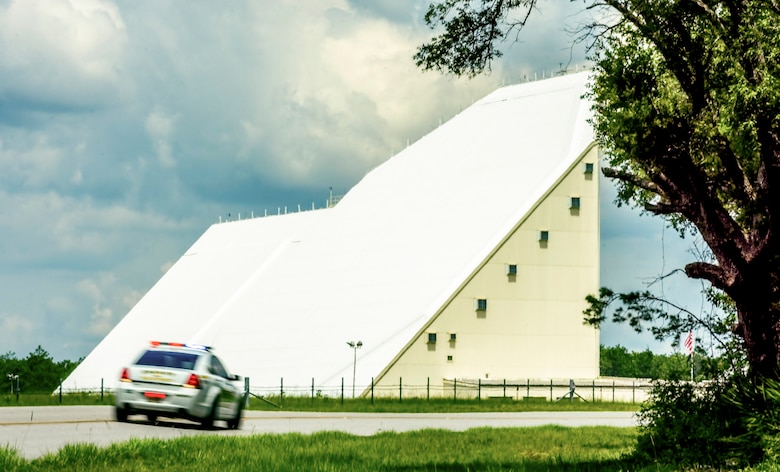 Deputy Ross Richards, Walton County Sheriff’s Office, responds to a report of shots fired at the 20th Space Control Squadron during active shooter training at site C-6 Eglin Air Force Base, Fla., June 27. Geographically separated from Eglin main by 25 miles, responding to incidents creates a challenge for the 96th Security Forces Squadron. The base unit has an agreement with WCSO to respond to any site C-6 emergency. Walton County Sheriff deputies and first responders from Eglin participated in the joint exercise to improve local active shooter processes, communication, and response coordination. (U.S. Air Force photo/Kristin Stewart)